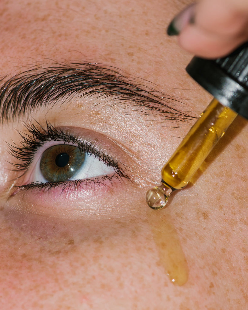 Close up of Bl+C Pimples Serum Concentrate on skin.