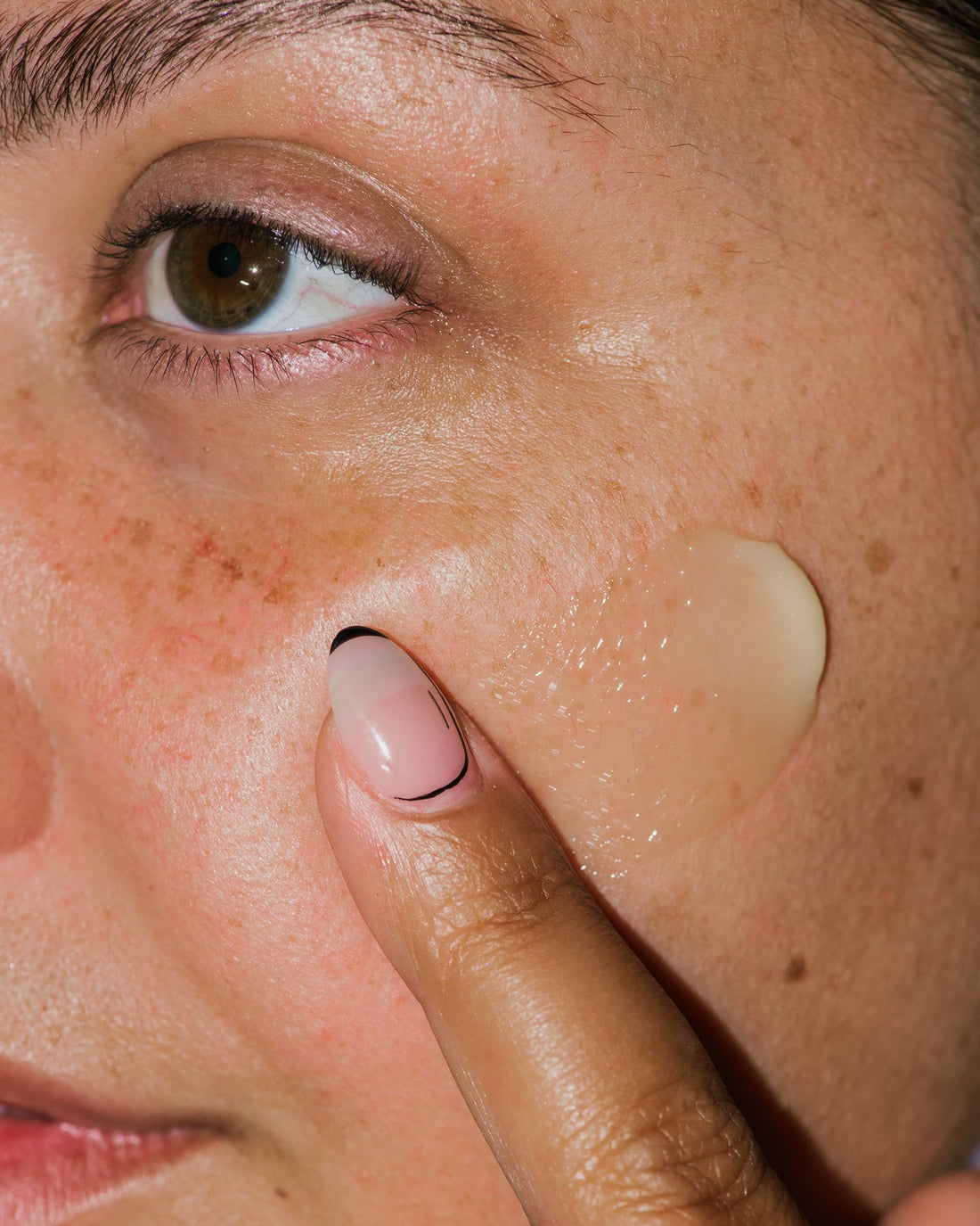 Close up of Nourishing Botanical Facial Balm on skin.