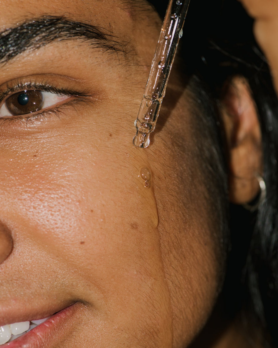 Close up of Compound K Hyaluronic Booster on face.